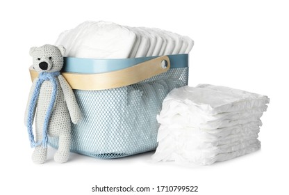 Disposable Diapers And Toy Bear On White Background