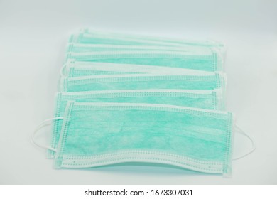 Disposable Ear Loop Face Mask Isolated On A White Background For Doctor And Everybody To Protects  Coronavirus (COVID-19) And Protects  Against Airborne Particles And Fluid