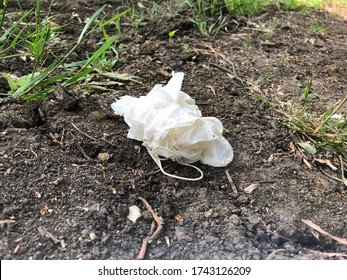 Disposable Latex Gloves: PPE Thrown On The Ground After Use During COVID-19 Outbreak. Litter And Nature Background.