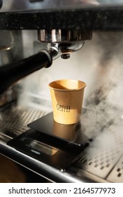 Disposable Paper Cup, Coffee Preparation, Cooking Process, Hot Steam. Selective Focus, Noise, Film Grain.Barista Work. The Concept Of Cooking Coffee, Coffee To Go