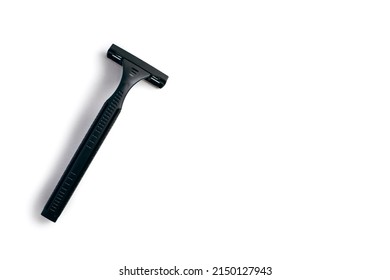 Disposable Plastic Razor In Black On A White Isolated Background. Black Male Razor With Free Space For Text. Skin Care Razor And A Preppy Look For A Man