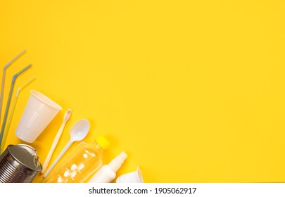 Disposable White Plastic Dishes And Trash With Place For Text On Yellow Background. View From Above. Flat Lay. Disposable Plastic Recycling Concept. Layout. Zero Waste, Save The Planet, Plastic Hazard