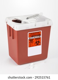 Disposing Medical Waste. 3/4 view. Medical and/or Dental waste into a medium size Sharps container. White background. - Shutterstock ID 292515761
