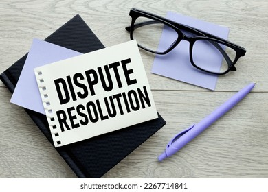 Dispute resolution. sticker text on black notepad - Shutterstock ID 2267714841