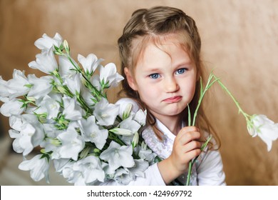 Dissapointed Kid Girl With Broken Flower In Hand