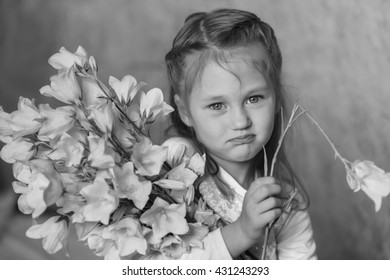 Dissapointed Kid Girl With Broken Flower In Hand