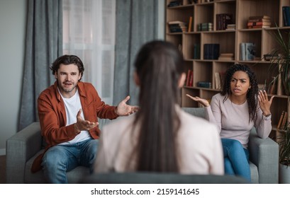 Dissatisfied Angry Millennial African American Lady And European Man Quarrel And Scream On Consultation With Psychologist In Office Interior. Professional Help And Support, Problems In Family, Therapy