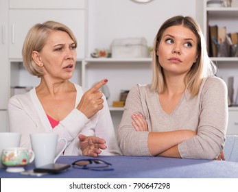 Dissatisfied Elderly Mother Chastises Saddened Grown-up Daughter