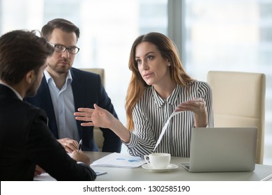 Dissatisfied executive manager having conflict with employee about financial report mistake, disgruntled clients claim complaint disputing about bad contract terms meeting lawyer, legal fraud concept - Shutterstock ID 1302585190