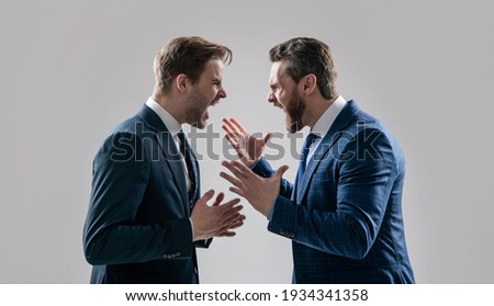 dissatisfied men discuss failure. two colleagues have disagreement and conflict. businessmen face to face. disrespect and contradiction. business partners blame each other. arguing businesspeople.