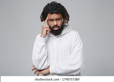 Dissatisfied Puzzled Young African American Man With Dreadlocks 20s Wearing White Casual Streetwear Hoodie Posing Put Hand On Head Looking Camera Isolated On Grey Color Background Studio Portrait