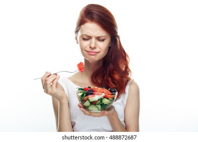 Dissatisfied Rastroennyh Face Woman On A Diet. Strict Diet. Salad