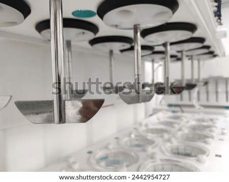 Dissolution Apratus with paddle in pharma formulation company with selective focus