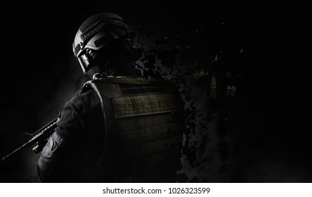 Dissolving swat soldier back view. Black and white swat soldier back view posing with dissolving effect on black background.
