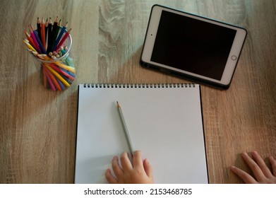 Distance Education Concept. Above Top View Of Female Student Sitting At Desk, Writing In Notebook, Taking Notes, Using Laptop, Having Online Class With Teacher. Remote Studying From Home, Quarantine