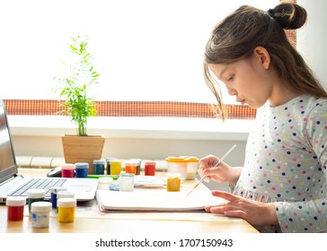 Distance education concept. Covid lockdown. Caucasian girl learns to draw online during self-isolation - Powered by Shutterstock