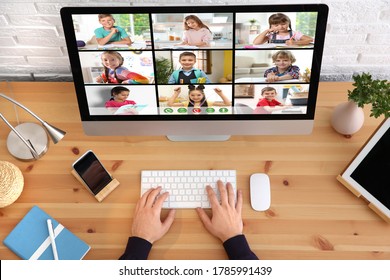 Distance education during quarantine and lockdown due to Covid-19 pandemic. Teacher giving online school lesson, top view - Powered by Shutterstock