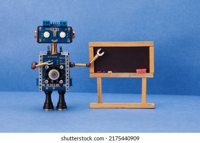 Distance education online learning concept. Robot teacher, abstract classroom interior with empty blackboard. Blue wall background. mockup chalkboard - Shutterstock ID 2175440909