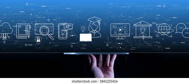 Distance Learning Concept With Hand Using A Digital Tablet Computer On Grey Blue Background.