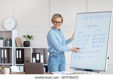 Distance Learning During Coronavirus. Female University Lecturer Teaching Calculus On Web, Conducting Math Class Online, Copy Space. Young Teacher Explaining Mathematics Problems On Internet