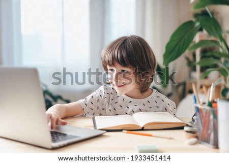 Similar – Image, Stock Photo happy school girl doing homework. Smart child working hard