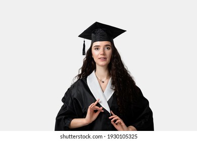 Distance Learning Online. Study At Home. Graduation From College. Graduate In Black Robe Smile On White Background. Funny Woman Smiling After Successful Finish University And Complete Master Degree