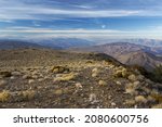 Distant Aerial Landscape View from Wildrose Mountain Peak across Death Valley National Park in California with Distant Sierra Nevada Mountains on Skyline