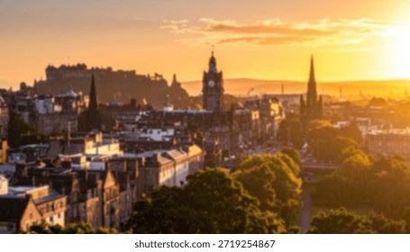 Distant cityscape view at sunset with castle, clock tower, spires, trees, and buildings.