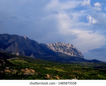 
distant cliffs against the sky and clouds