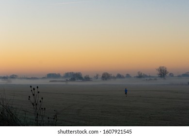 Distant Lone Runner On A Frosty, Misty Morning Run