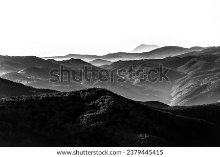 
Distant mountain range in black and white - Ravensca monochrome - foggy hills and peaks - dramatic monochrome mountain landscape - Ravensca, Romania