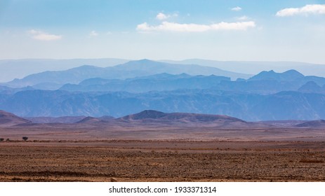 Distant Mountains In The Morning Haze In The Arava Desert On The Road To Eilat In Israel