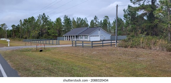Distant pillar home real estate from roadside in North Florida December 7 2021 Starke Florida United States