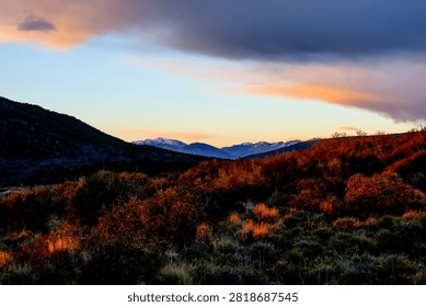 Distant Snow-Capped Mountains at Sunset