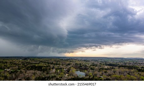 A distant thunderstorm creeps closer, overtaking what was a beautiful sunset foreshadowing what's to come with it's inevitable arrival.  - Shutterstock ID 2155469017