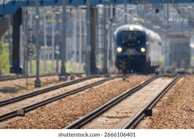 a distant train approaching the Kraków Zabłocie station