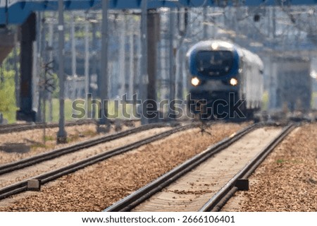 a distant train approaching the Kraków Zabłocie station