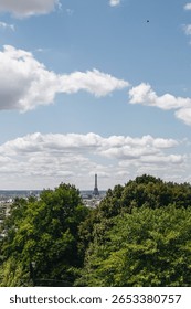 Distant View of Eiffel Tower from Parc de Belleville – Elevated Perspective over Paris Rooftops