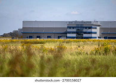 Distant view of the logistics center's warehouse. Photo taken on a sunny day.