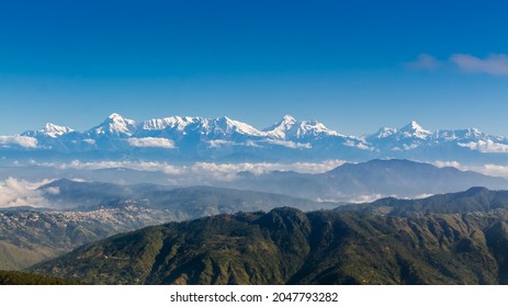 Distant view of the majestic Himalayan range from KMVN Mukteshwar, Tourist rest house, Uttarakhand, India - Shutterstock ID 2047793282