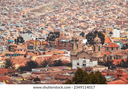Distant view of the roofs and houses in Potosi city an the Cathedral Basilica of Our Lady of Peace. Bolivia, Southamerica.