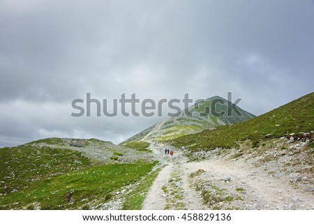 A distant view of the summit of the Holy mountain of Croagh Patrick with people climbing to reach the top, near Westport, County Mayo, Ireland