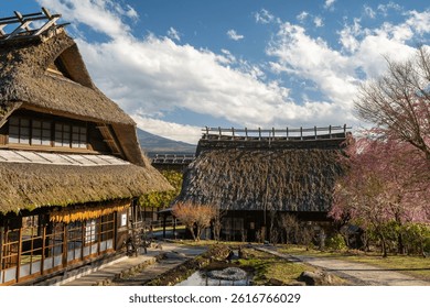 Distinctive thatched-roof farmhouses of Iyashi no Sato, a reconstructed traditional Japanese village near Mount Fuji, Japan