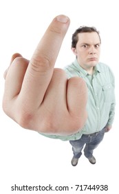 Distorted image of a displeased young man showing middle finger. Fish-eye lens was used, focus is on the hand. Studio shot. Isolated on pure white background.