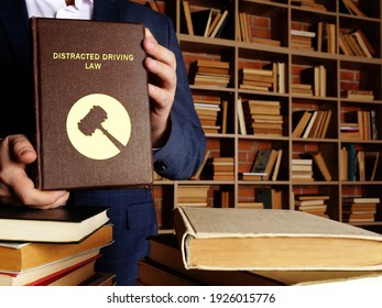  DISTRACTED DRIVING LAW Book In The Hands Of A Jurist. Distracted Driving occurs When A Driver Undertakes Any Activity That Diverts Attention Away From Driving
