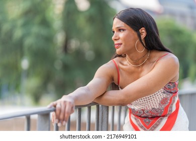 Distracted Transgender happy woman in a park - Powered by Shutterstock