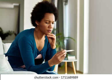 Distraught Black Woman Checking Her Temperature Stock Photo 1711689889 ...