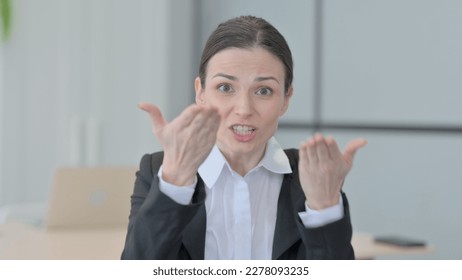 Distraught Businesswoman Talking in Anger and Stress