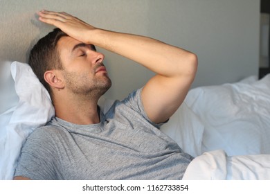 Distraught Man With Hand In Forehead