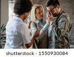 Distraught veteran crying while being with his wife at medical counselling at the clinic. 